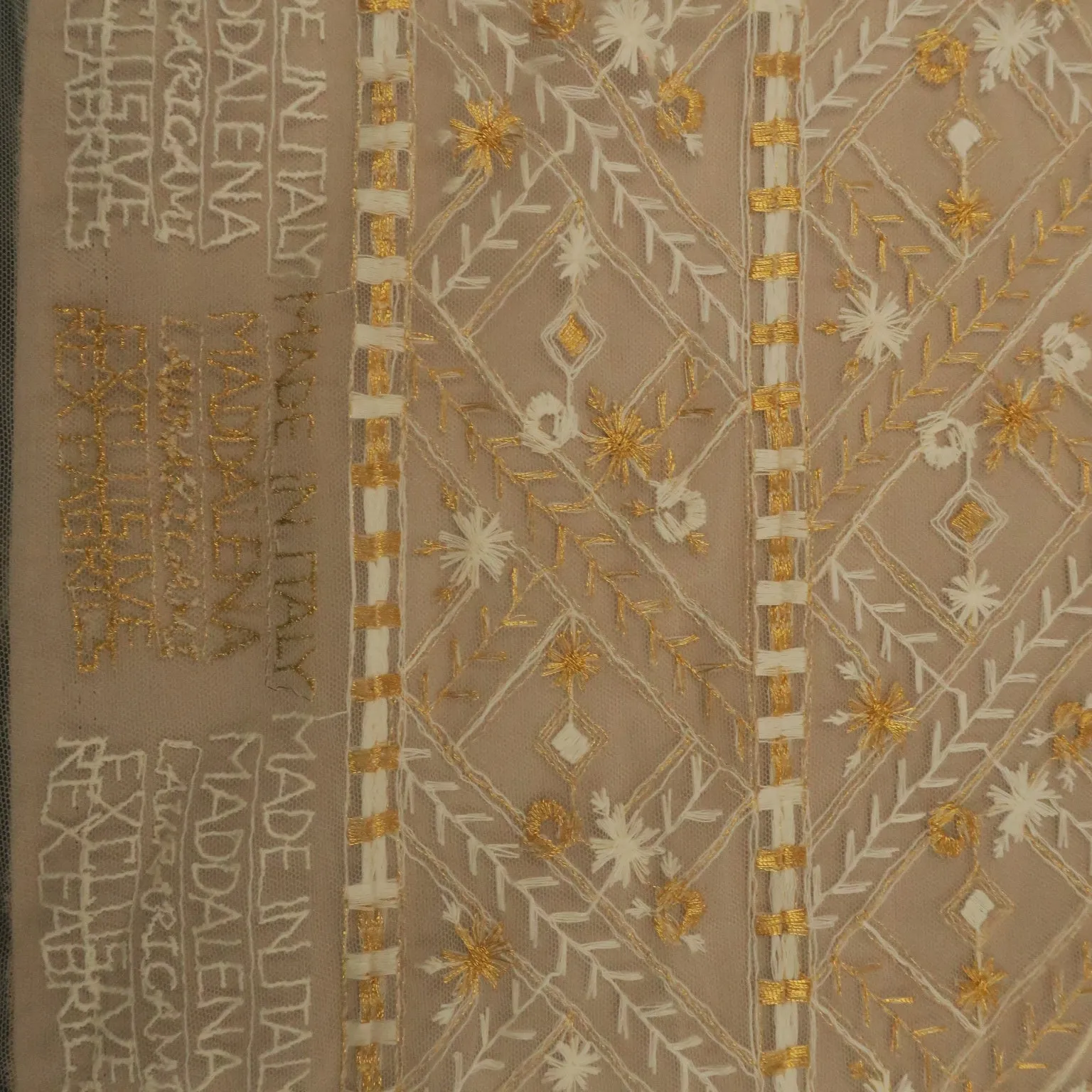 White Tulle With Gold and White Snowflake Design Embroidered Fabric