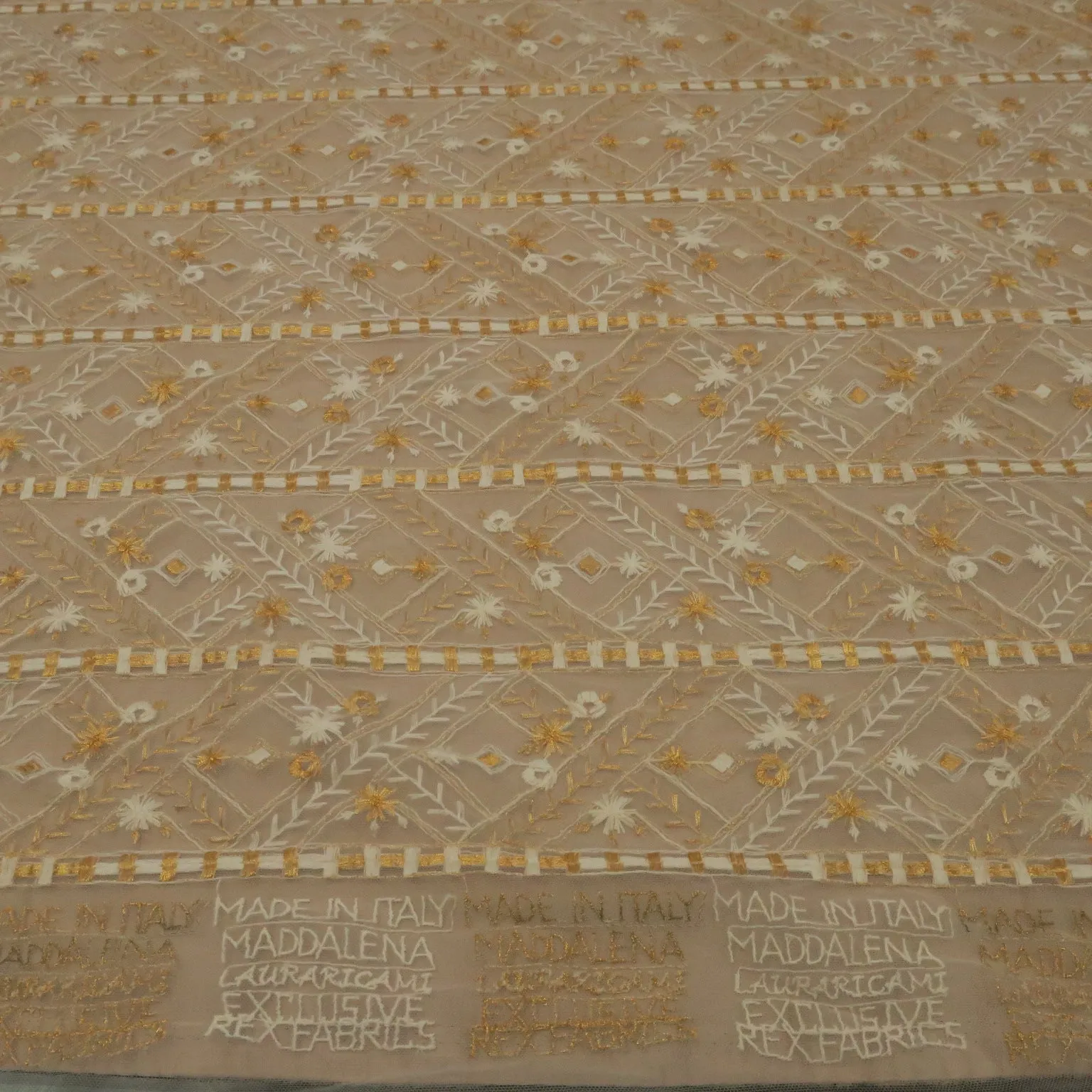 White Tulle With Gold and White Snowflake Design Embroidered Fabric